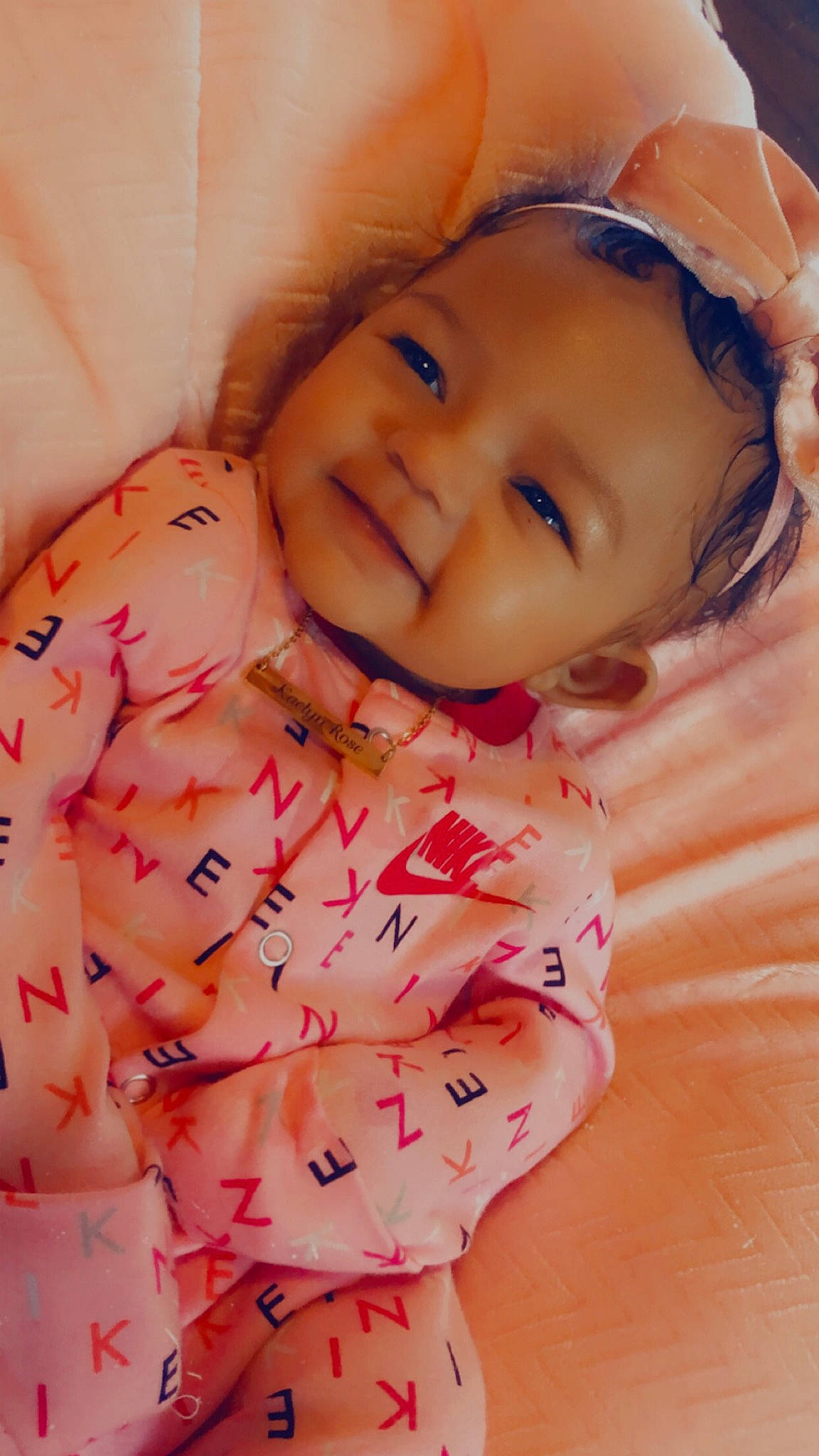 Kaelyn joined the competition — help win amazing prizes! baby, baby_laughing, baby_toddler_clothing, cheek, child, facial_expression, iris, laugh, lip, nightwear, peach, person, pink, pleased, skin, sleeve, toddler