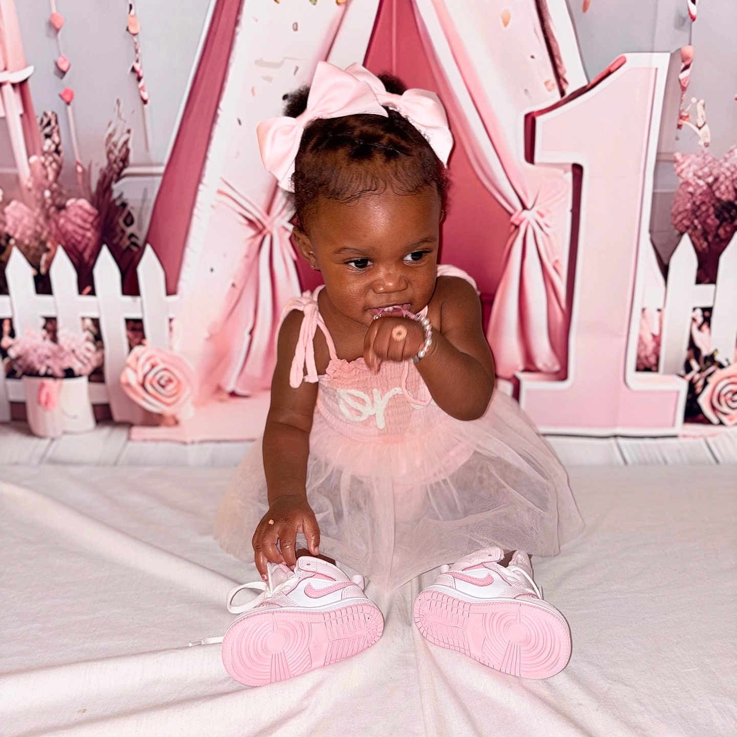 Kiyanni joined the competition — help win amazing prizes! toddler, child, birthday, pink, sneakers, dress, bow, tent, flower, picket_fence, celebration, number_one, cute, indoor, portrait, happy, playful, clothing, person, smile