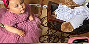 Iris participe au concours pour gagner de l'argent avec cette photo : baby, child, pink_dress, headband, bow, teddy_bear, doll_carriage, indoor, floor, carpet, wooden_floor, toy, smiling, sitting, cute, portrait, young_child, accessory, happy, person