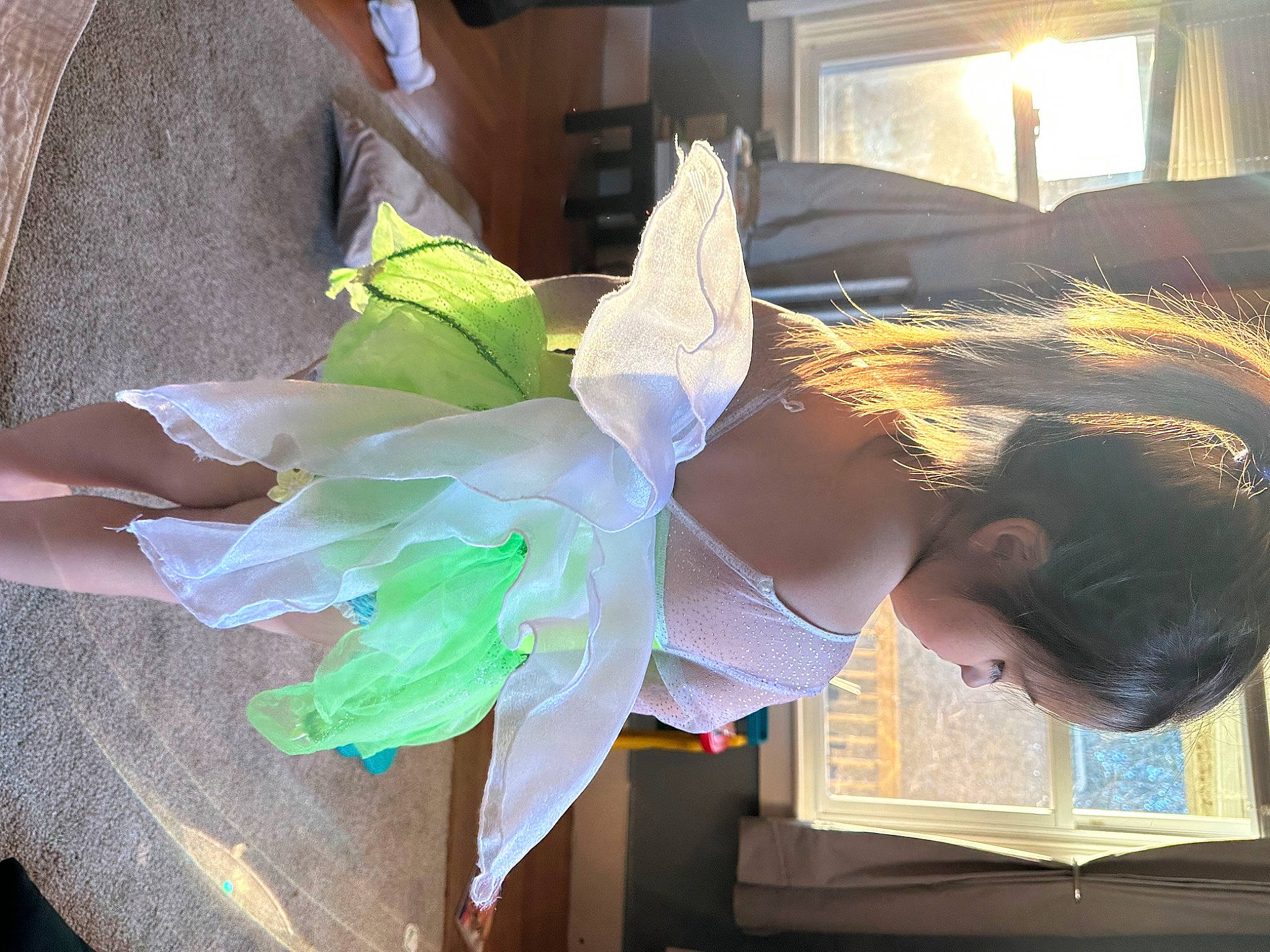 Sara is registered to the contest to win money with this photo: art, ballet_tutu, bridal_accessory, child, costume, costume_design, dress, event, fashion_design, feather, fun, headpiece, paper, party_supply, person, picture_frame, room, textile, visual_arts, window