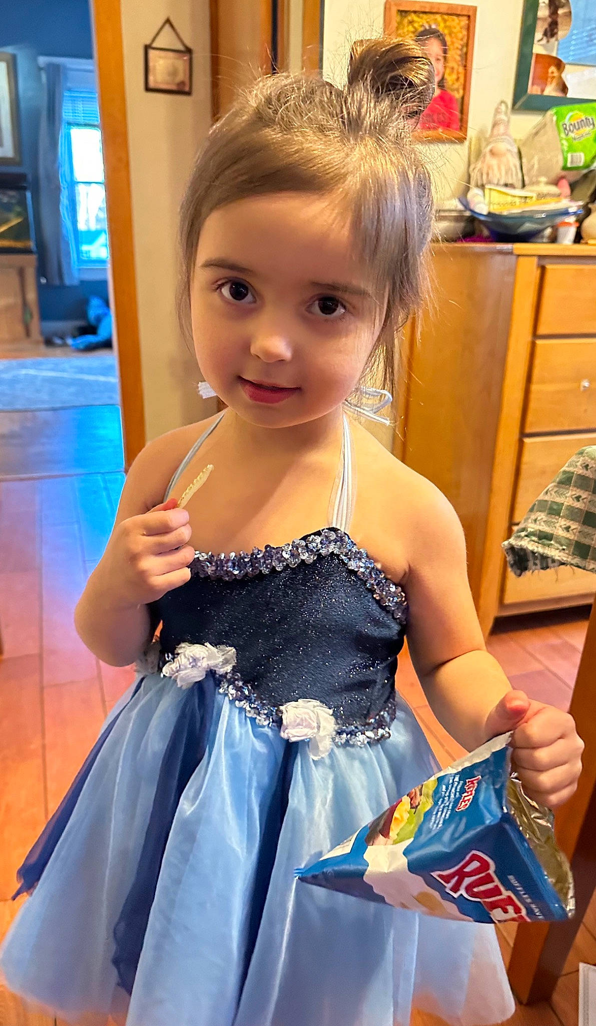 Sara is registered to the contest to win money with this photo: bangs, black_hair, day_dress, dress, electric_blue, embellishment, event, eyelash, fashion_design, formal_wear, fun, hairstyle, happy, iris, jewellery, long_hair, person, smile, toddler, trunk