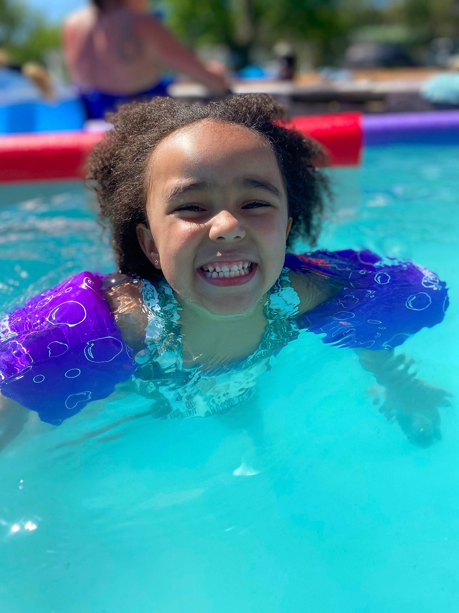 Adalynn is registered to the contest to win money with this photo: aqua, bathing, blue, child, event, fun, games, happy, headgear, joy, leisure, leisure_centre, outdoor_recreation, person, personal_protective_equipment, recreation, smile, swimmer, swimming_pool, swimwear