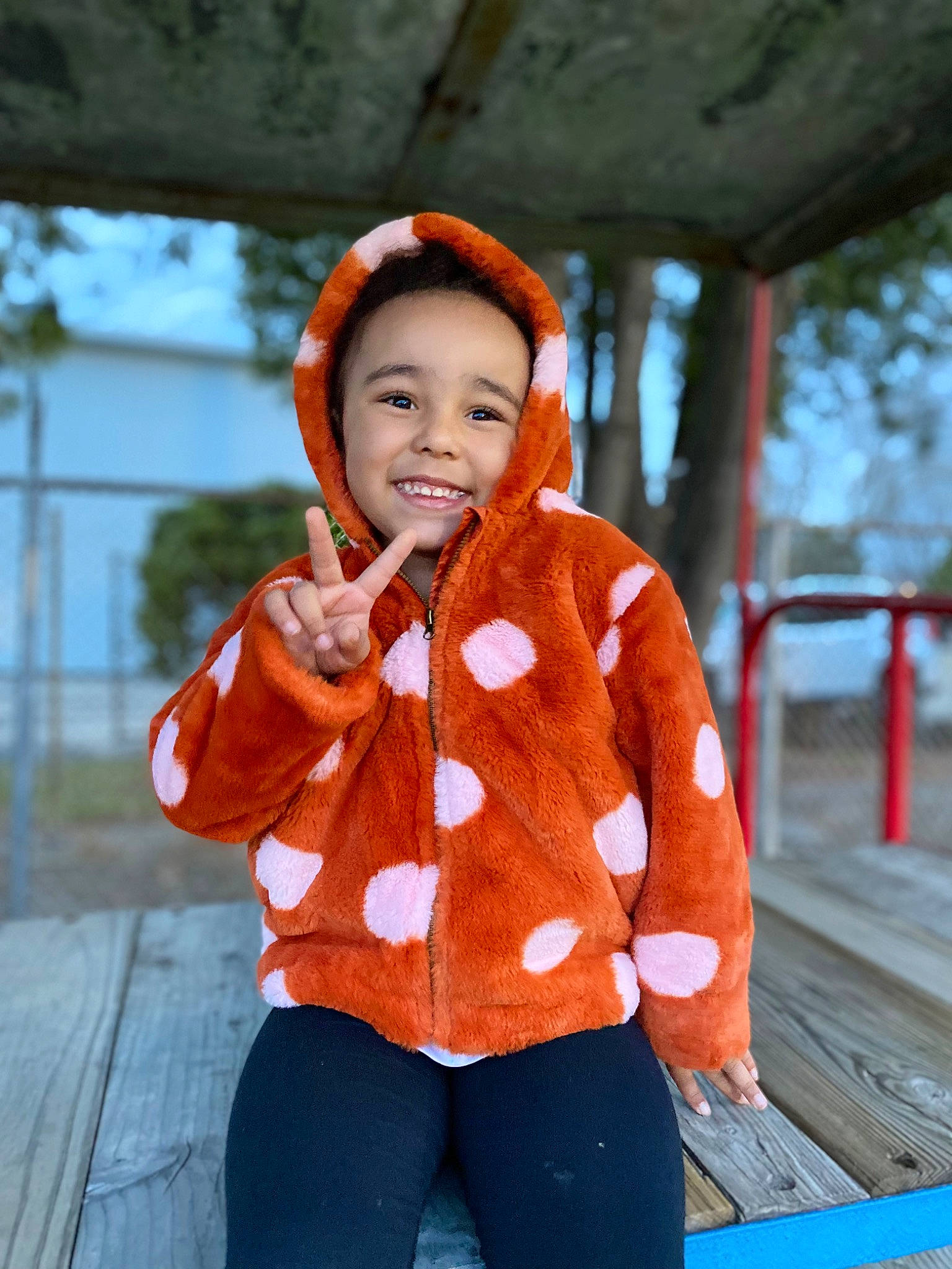 Adalynn joined the competition — help win amazing prizes! baby, baby_toddler_clothing, child, electric_blue, eye, fun, gesture, happy, joy, leisure, neck, orange, pattern, person, recreation, sitting, sleeve, smile, toddler, travel