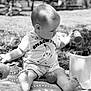 Tobias a rejoint le concours — aidez-le/la à gagner de superbes lots ! toddler, child, outdoor, black_and_white, sitting, blanket, toy, container, banana_graphic, shirt, shorts, feet, grass, nature, playtime, art_supplies, bucket, curious, portrait, baby