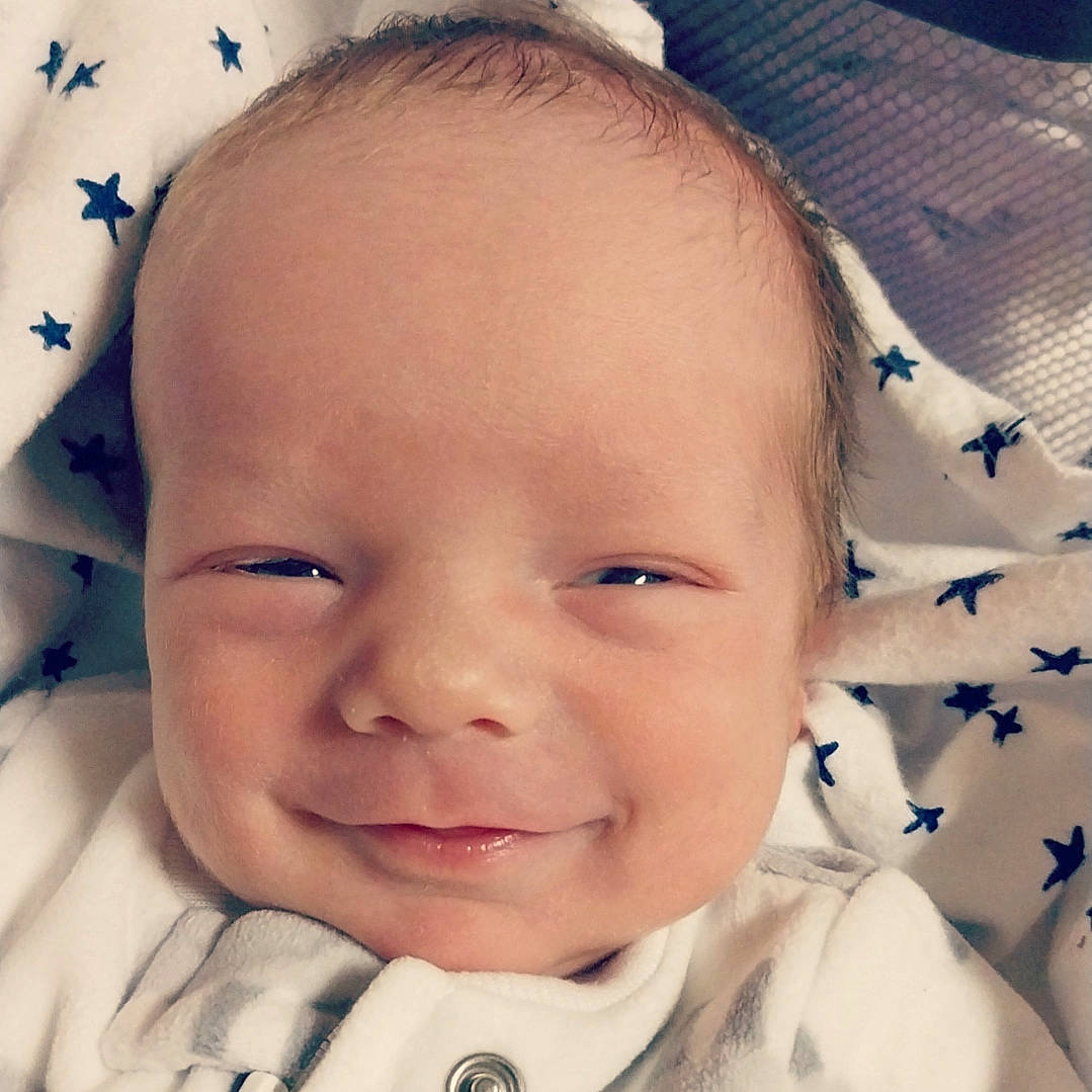 Carter is registered to the contest to win money with this photo: baby, blue, cheek, chin, ear, eye, eyebrow, eyelash, happy, head, iris, joy, lip, mouth, nose, organ, person, skin, sleeve, smile