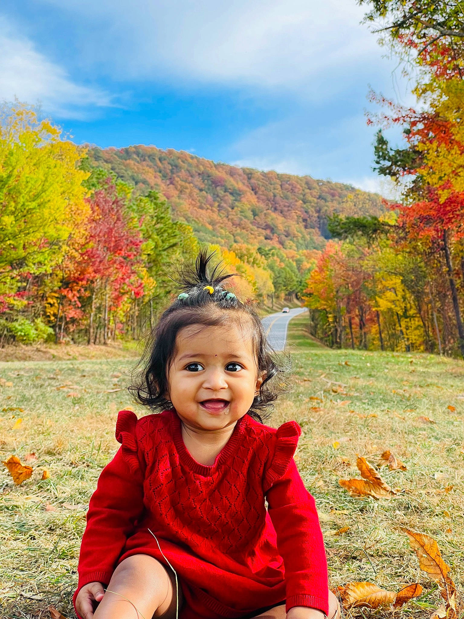 Ayra is registered to the contest to win money with this photo: beauty, botany, cloud, grass, grassland, happy, joy, landscape, leaf, leisure, mountain, natural_landscape, people_in_nature, person, plant, sky, smile, toddler, travel, tree