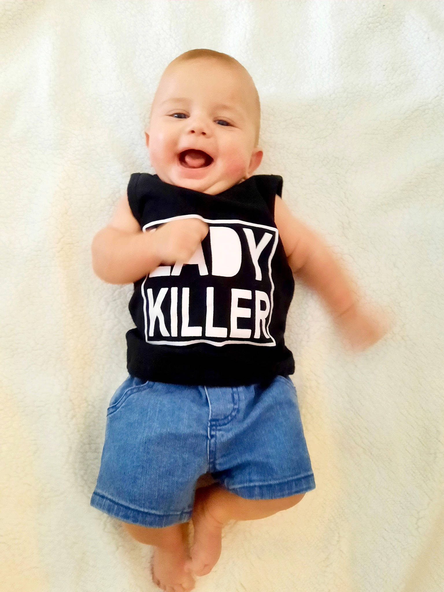 Boden is registered to the contest to win money with this photo: baby, baby_toddler_clothing, clothing, denim, eye, face, font, happy, jersey, neck, person, shorts, sleeve, sleeveless_shirt, smile, sportswear, street_fashion, t_shirt, thigh, toddler
