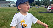 Zain joined the competition — help win amazing prizes! child, toddler, boy, cap, tshirt, shorts, grass, outdoor, daylight, expression, park, sky, building, people, summer, nature, casual, playful, cute, green