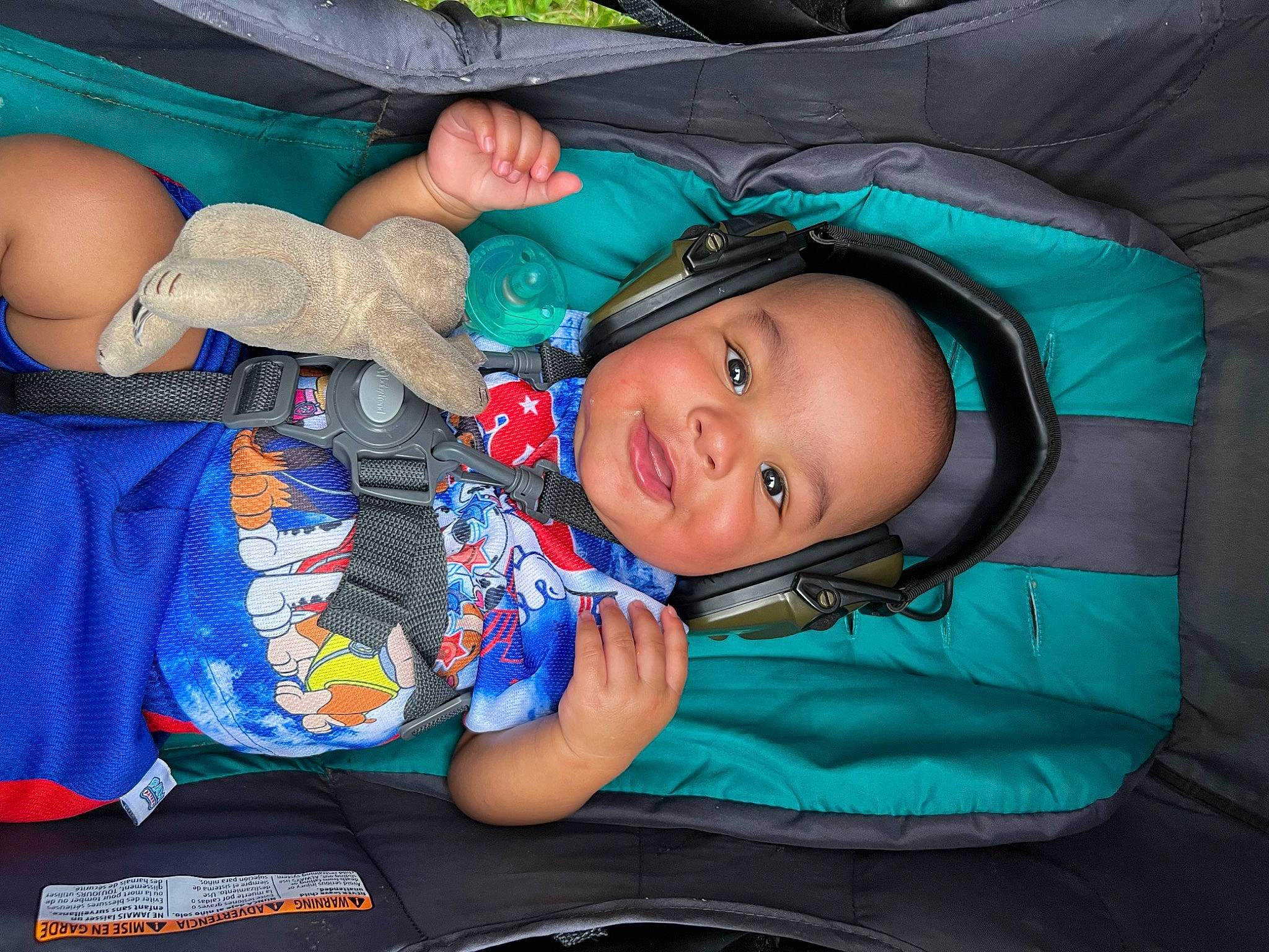 Oliver is registered to the contest to win money with this photo: automotive_tire, azure, baby, baby_products, child, comfort, cool, electric_blue, eye, fun, hand, happy, head, human_body, leisure, mouth, person, product, smile, toddler