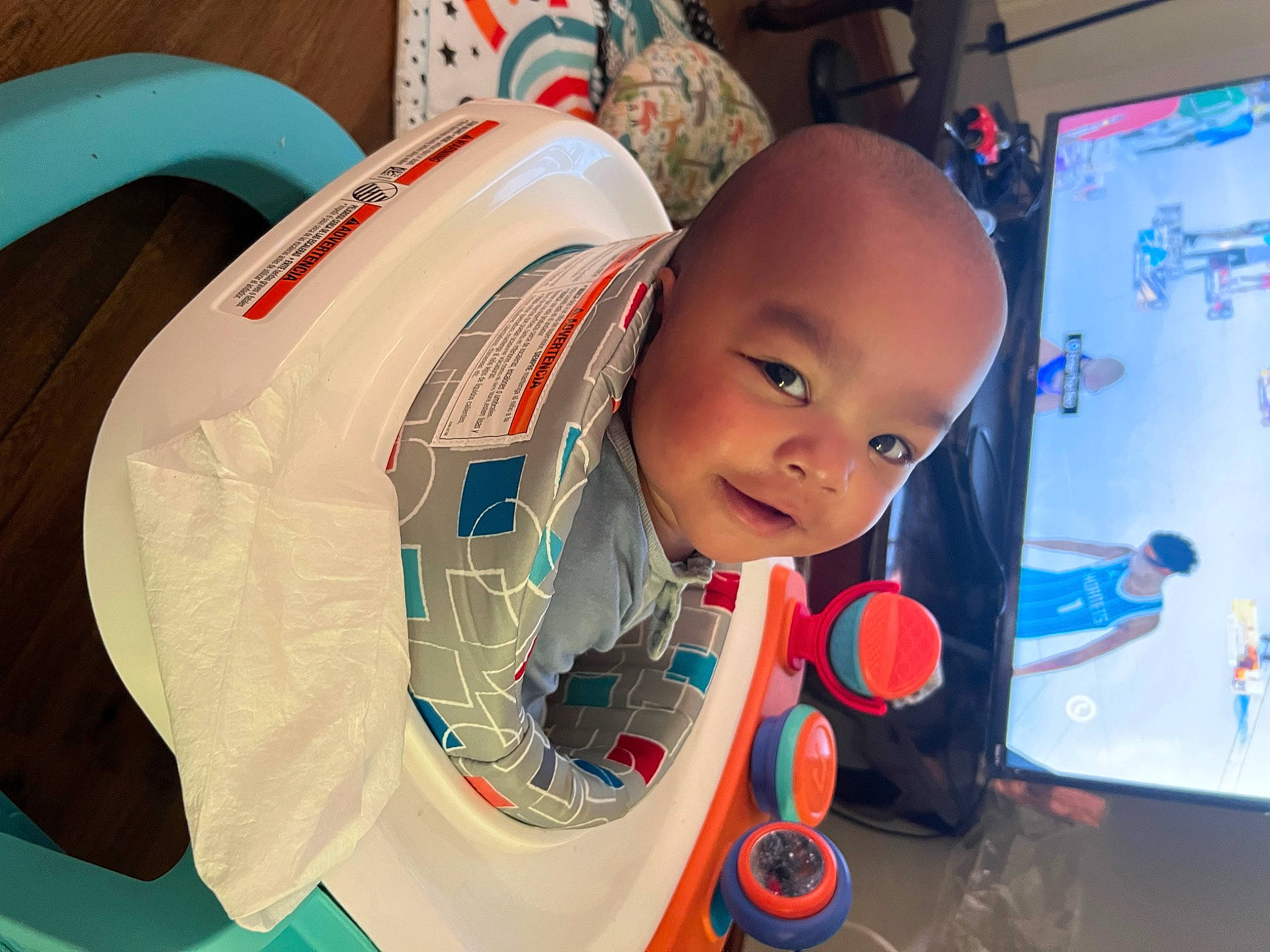 Oliver is registered to the contest to win money with this photo: baby, baby_products, baby_toddler_clothing, child, comfort, computer_monitor, electric_blue, fun, happy, leisure, machine, person, personal_protective_equipment, play, product, recreation, sitting, smile, space, t_shirt