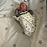 newborn, baby, crib, swaddle, sleeping, hat, striped_clothing, stars, blanket, infant, bed, resting, cute, child, soft, pattern, nursery, toddler, peaceful, sleep