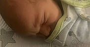 Julian is registered to the contest to win money with this photo: baby, bed, blanket, closeup, comfort, cute, fabric, face, head, indoors, infant, newborn, patterned, peaceful, person, resting, skin, sleeping, soft_lighting, swaddled