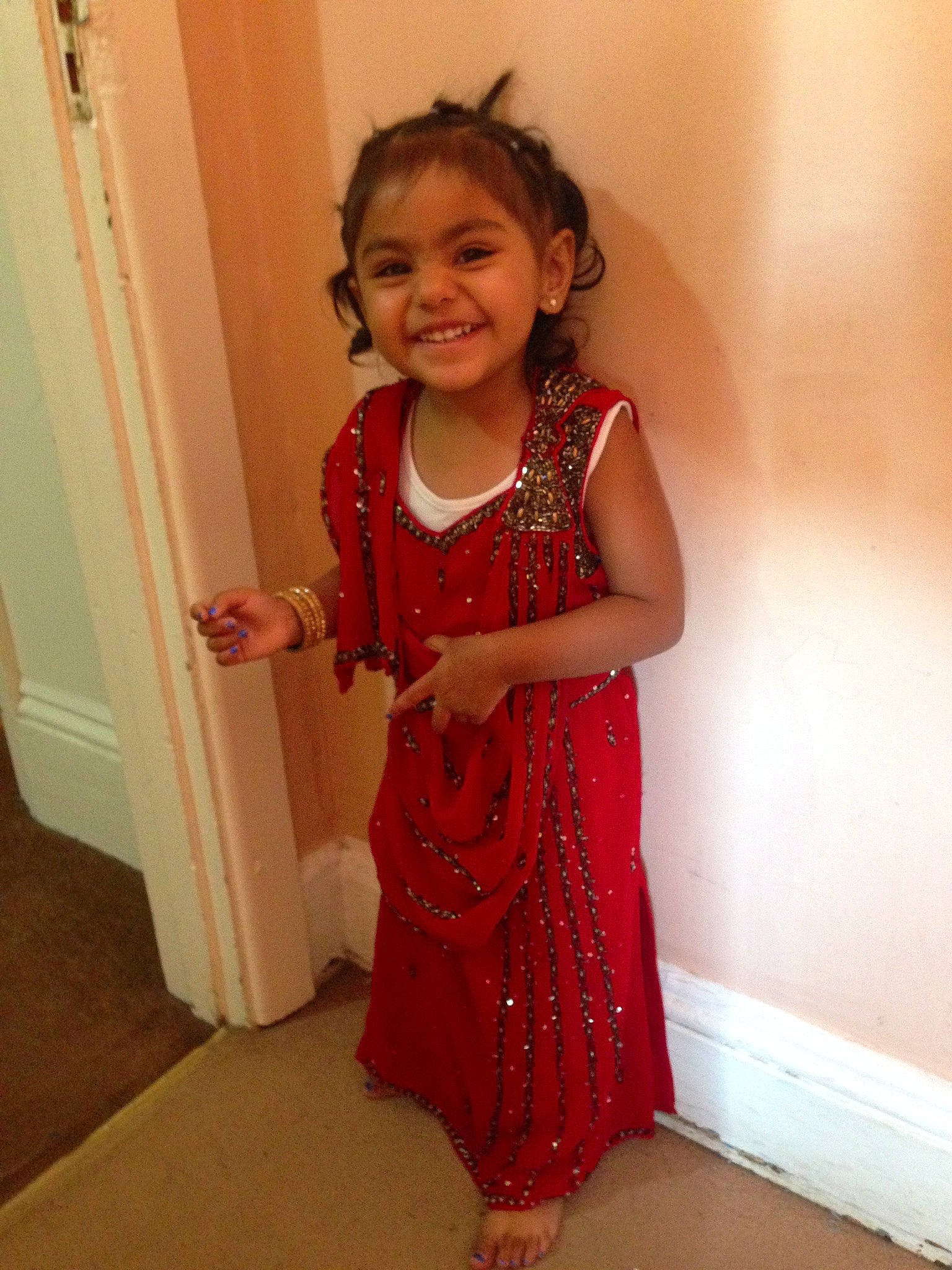 Alisha joined the competition — help win amazing prizes! day_dress, door, dress, face, fashion_design, flooring, hair, hand, happy, head, human_body, joy, neck, one_piece_garment, person, pink, shoulder, sleeve, smile, toddler