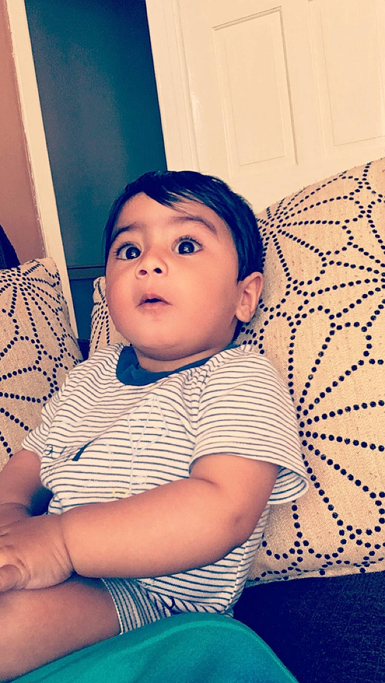 Rayan is registered to the contest to win money with this photo: arm, baby_toddler_clothing, cheek, chin, comfort, cool, eye, eyebrow, finger, flash_photography, fun, happy, iris, lip, mouth, neck, nose, person, purple, skin