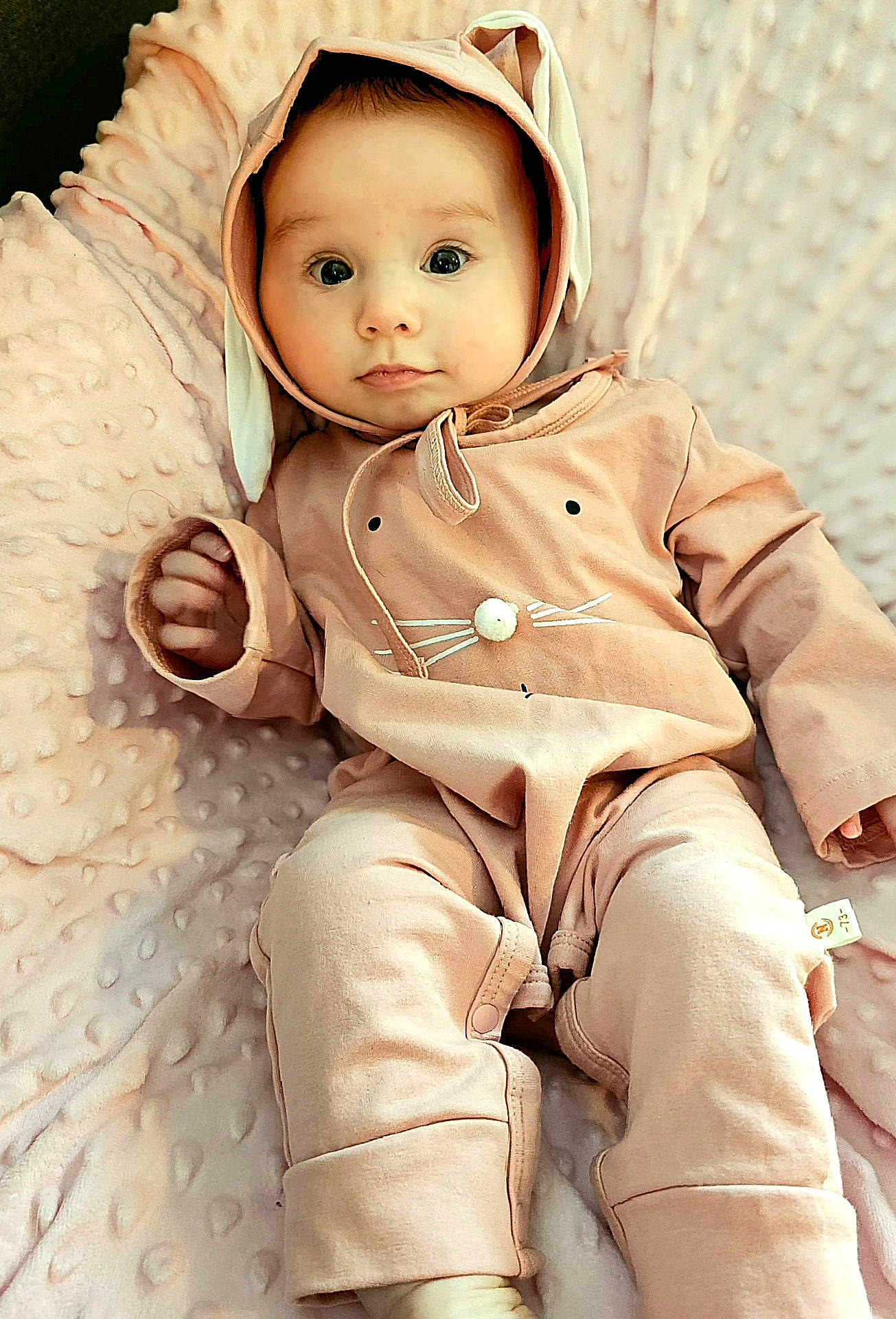 Freya joined the competition — help win amazing prizes! baby, bodypart, bonnet, clothing, coat, face, finger, happy, hat, head, hood, hoodie, knitwear, pants, person, photography, portrait, smile, sweater, sweatshirt