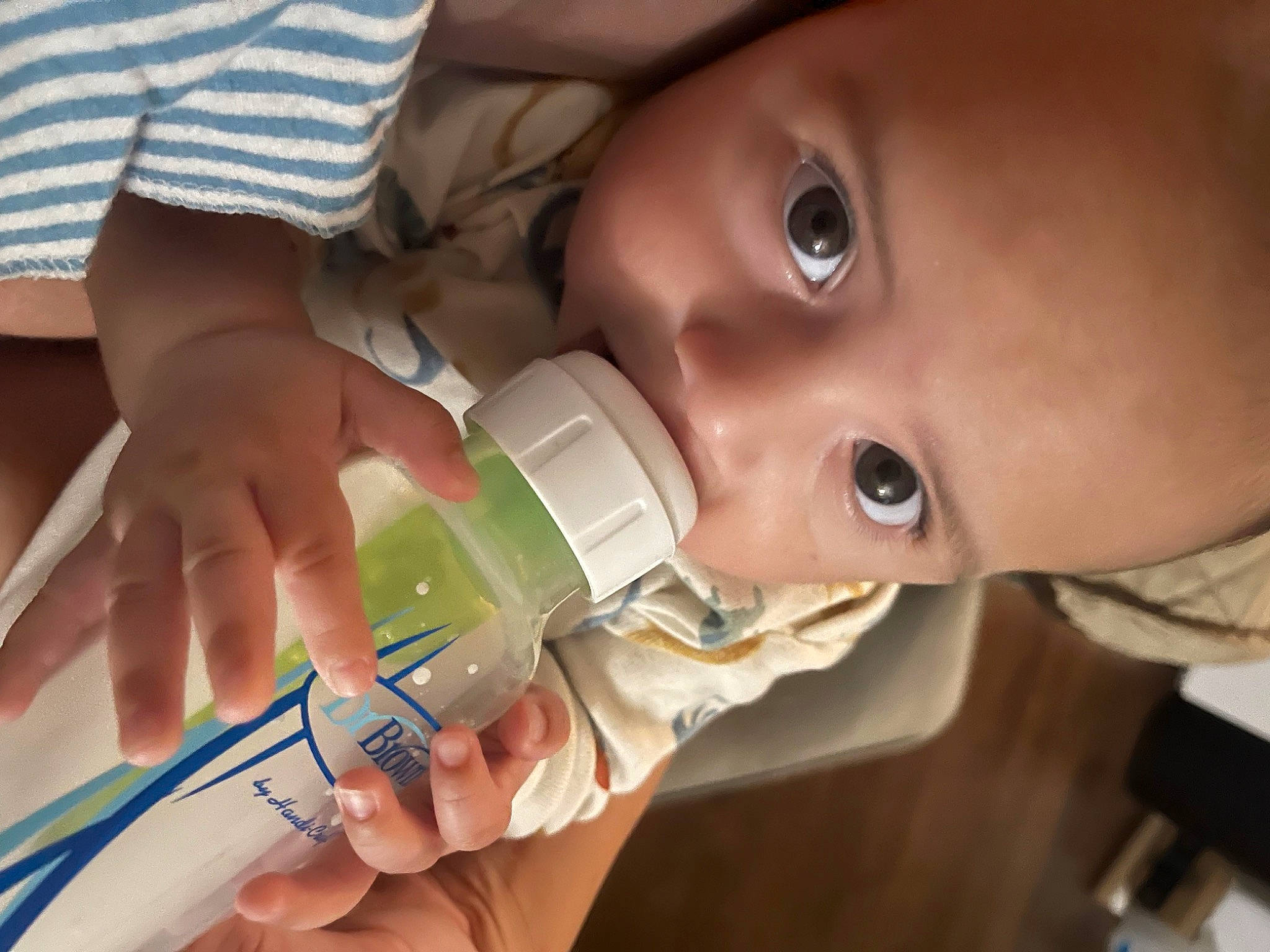 Gabriel joined the competition — help win amazing prizes! baby, baby_bottle, bottle, cheek, drinking, drinkware, ear, eyebrow, eyelash, face, finger, fluid, head, infant_formula, mouth, nail, nose, person, plastic_bottle, skin