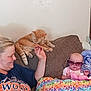 Maylee joined the competition — help win amazing prizes! baby, blanket, casual, cat, colorful, comfort, couch, furniture, happy, headwear, indoor, orange_cat, person, plush, relaxing, seated, smile, sunglasses, toy, woman