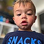 Elijah joined the competition — help win amazing prizes! blurry_background, casual_clothing, child, closeup, curious, expression, eyebrows, eyes, face, head, indoor, lips, person, portrait, shirt, short_hair, skin, text, toddler, young