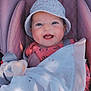 baby, blanket, bucket_hat, child, clothing, cozy, cute, face, happy, hat, indoors, infant, mickey_mouse, pattern, pink_cushion, plush_toy, portrait, seat, smiling, wrapped