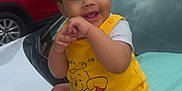 Jhlani Dockins joined the competition — help win amazing prizes! baby, child, smiling, yellow_clothing, sitting, car, hood, outdoor, cloudy_sky, red_car, playful, happy, cute, person, sock, shorts, toddler, winnie_the_pooh, vehicle, daytime