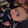 Oceann is registered to the contest to win money with this photo: adult, affection, baby, blanket, candid, child, closeup, cute, expression, face, indoor, kiss, love, parent, person, planets, portrait, rocket, space_pattern, stars