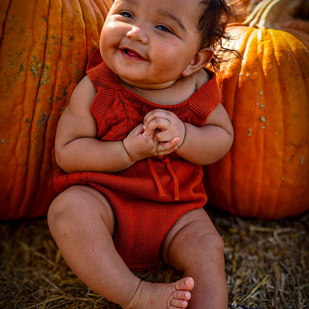 Malahney is registered to the contest to win money with this photo: autumn, baby, child, cute, face, fall, festive, happy, harvest, holiday, nature, orange_clothing, outdoor, portrait, pumpkin, seasonal, sitting, skin, smiling, straw