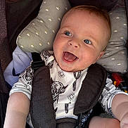 Maylan participe au concours pour gagner de l'argent avec cette photo : baby, smiling, stroller, child, infant, happy, seatbelt, pillow, clothing, face, closeup, cute, person, cheerful, skin, head, arm, mouth, eyes, patterned