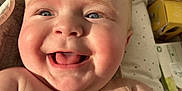 Maylan participe au concours pour gagner de l'argent avec cette photo : baby, smiling, tongue_out, blue_eyes, close_up, infant, skin, sunlight, happy, child, cute, cheeks, expression, person, indoors, newborn, joy, face, portrait, baby_supplies