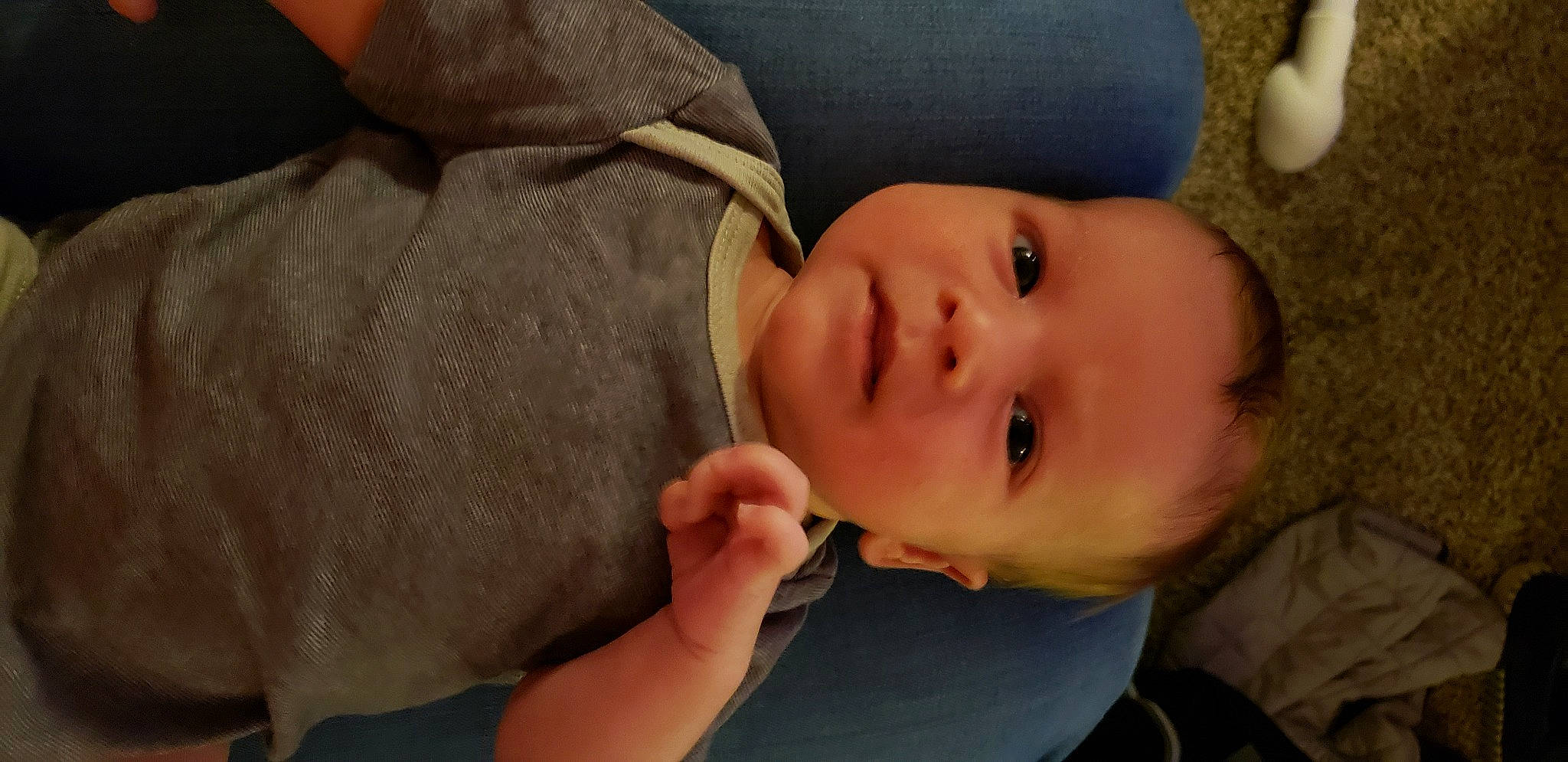 Axl is registered to the contest to win money with this photo: baby, baby_toddler_clothing, cheek, child, comfort, ear, eyebrow, eyelash, finger, gesture, hair, hand, happy, iris, lip, neck, nose, person, skin, textile