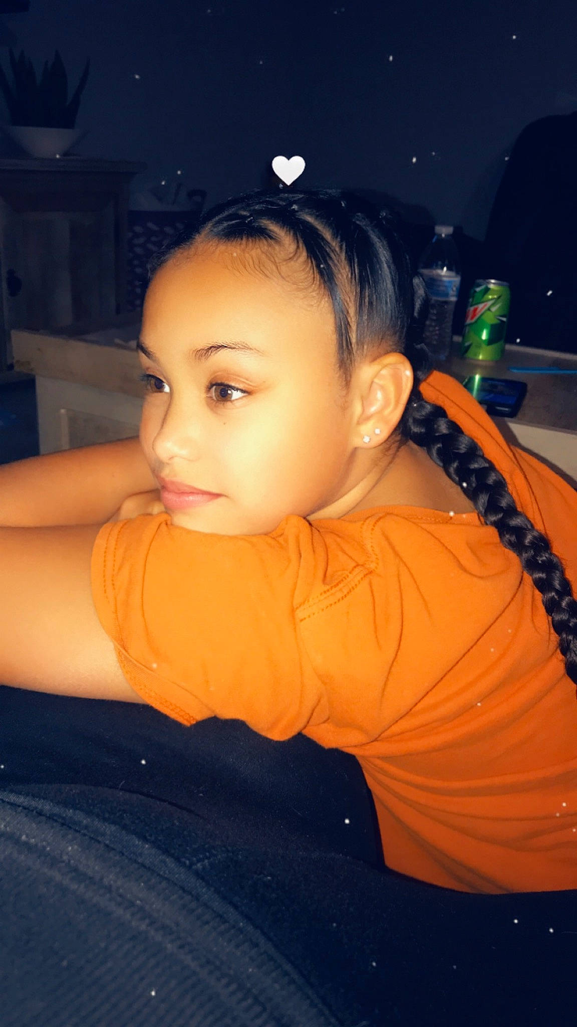 Jazmyne is registered to the contest to win money with this photo: abdomen, black_hair, chest, child, cool, ear, elbow, eyelash, flash_photography, fun, hairstyle, happy, jewellery, leisure, lip, midnight, nose, orange, person, sitting