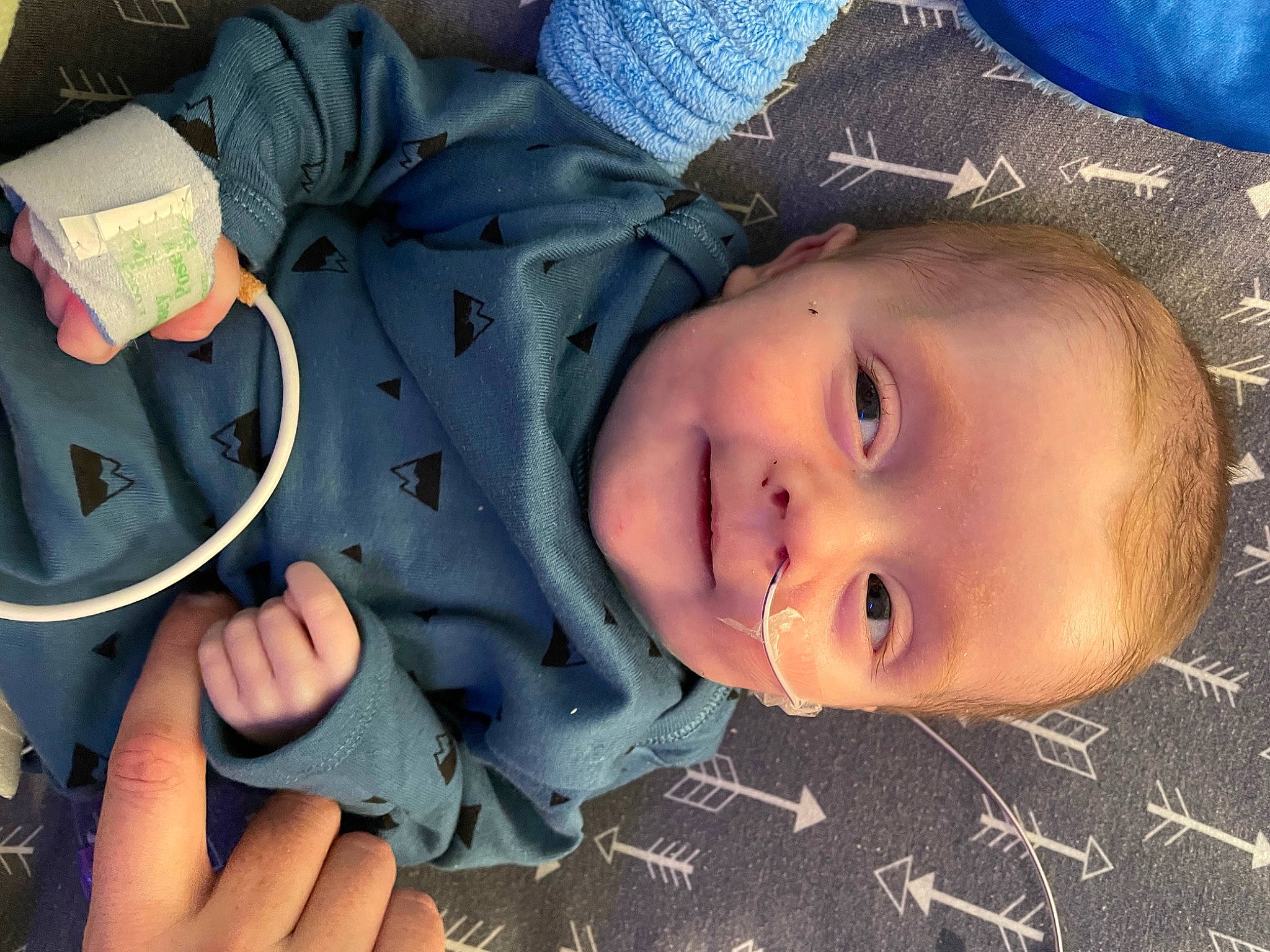 Clyde is registered to the contest to win money with this photo: baby, blue, cheek, cool, eye, facial_expression, gesture, grass, happy, head, headgear, human_body, iris, lip, mouth, nose, person, plant, skin, smile