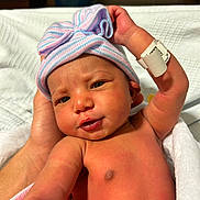 Casey joined the competition — help win amazing prizes! newborn, baby, infant, hat, striped_hat, bow, blanket, hospital, bed, hand, skin, face, eyes, mouth, chest, wrapping, person, cute, portrait, newborn_baby