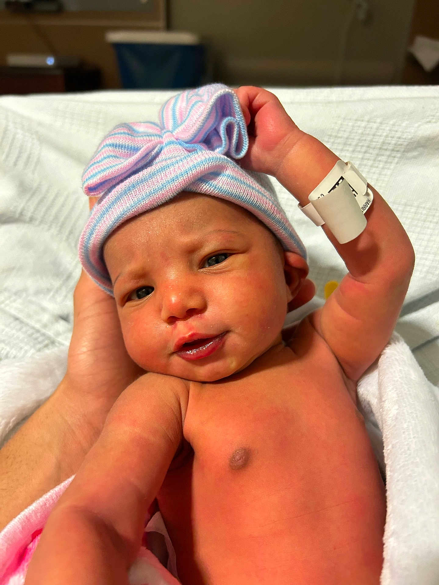 Casey joined the competition — help win amazing prizes! newborn, baby, infant, hat, striped_hat, bow, blanket, hospital, bed, hand, skin, face, eyes, mouth, chest, wrapping, person, cute, portrait, newborn_baby