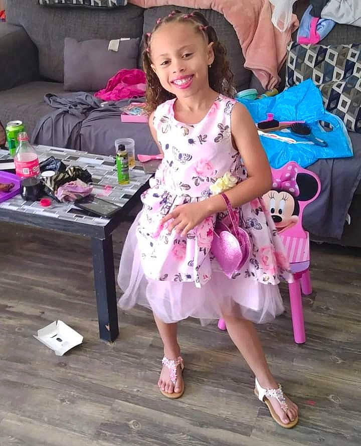 Alexandria is registered to the contest to win money with this photo: day_dress, dress, event, face, fashion_design, foot, footwear, hair, hairstyle, happy, joy, leg, leisure, magenta, person, pink, purple, sandal, skin, smile