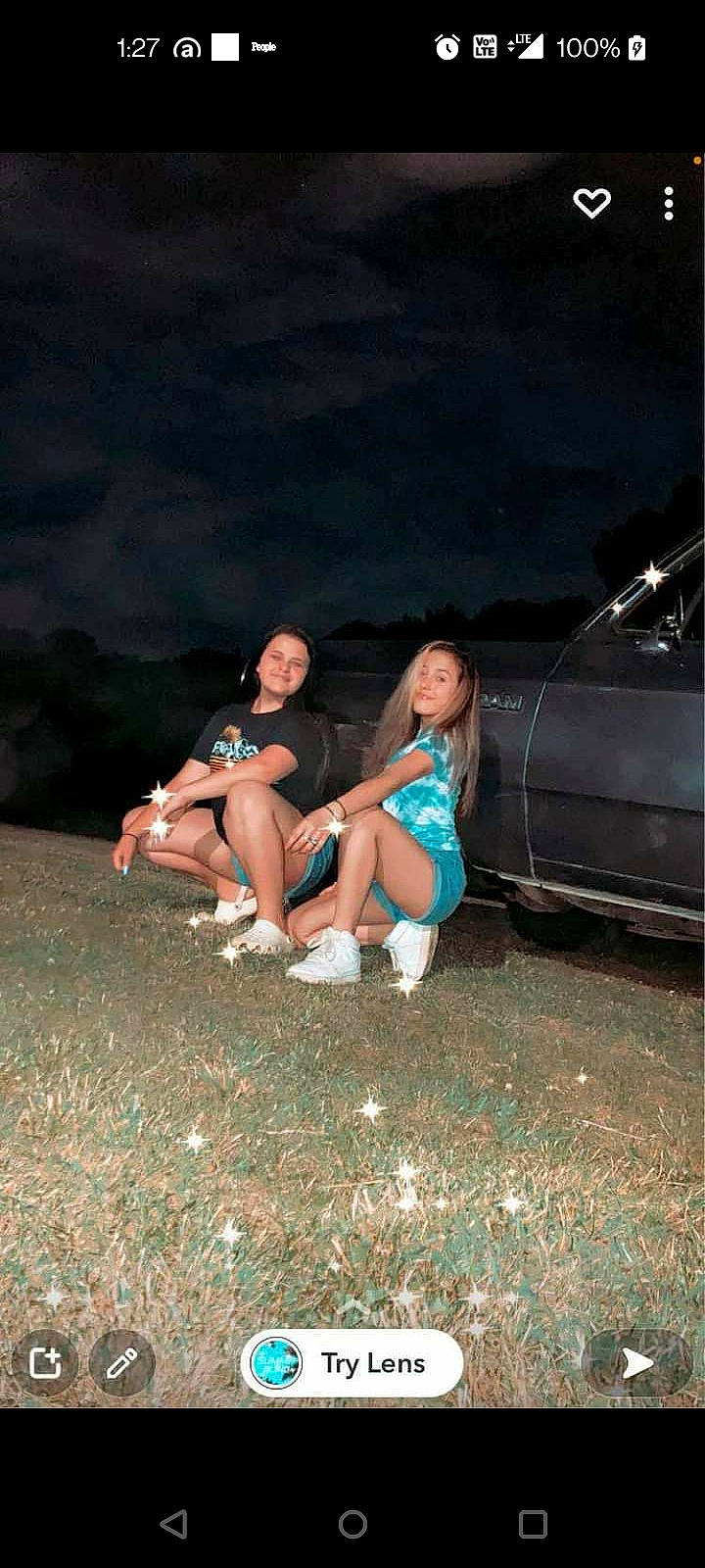 Karina is registered to the contest to win money with this photo: automotive_exterior, automotive_lighting, bumper, car, electric_blue, flash_photography, fun, grass, headlamp, human_body, human_leg, joy, leg, midnight, motor_vehicle, person, shorts, smile, sneakers, thigh