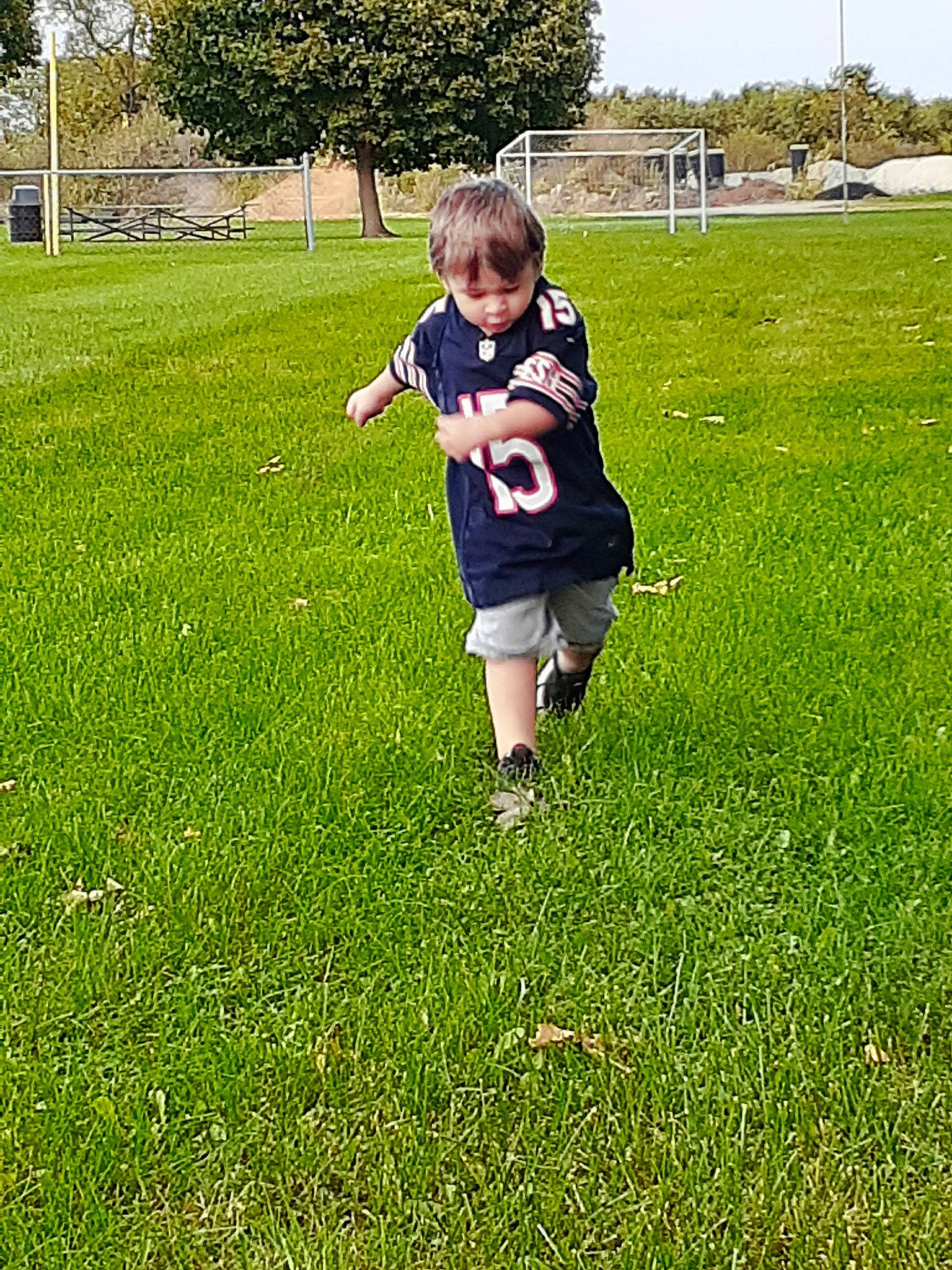 Nikolas is registered to the contest to win money with this photo: baby_toddler_clothing, child, grass, lawn, meadow, people_in_nature, person, play, sock, toddler, yard