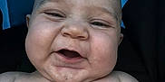 Faust joined the competition — help win amazing prizes! baby, infant, face, skin, chubby, smile, expression, closeup, head, shoulders, blue_background, black_background, happy, cute, child, portrait, human, young, naked_torso, funny_face