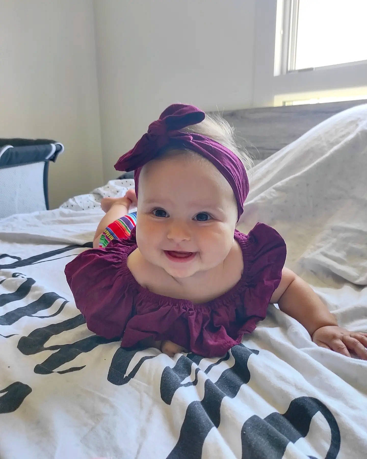 Gioia participe au concours pour gagner de l'argent avec cette photo : baby, baby_safety, baby_toddler_clothing, child, comfort, cool, event, eye, fun, happy, headwear, joy, mouth, pattern, person, pink, purple, skin, smile, toddler