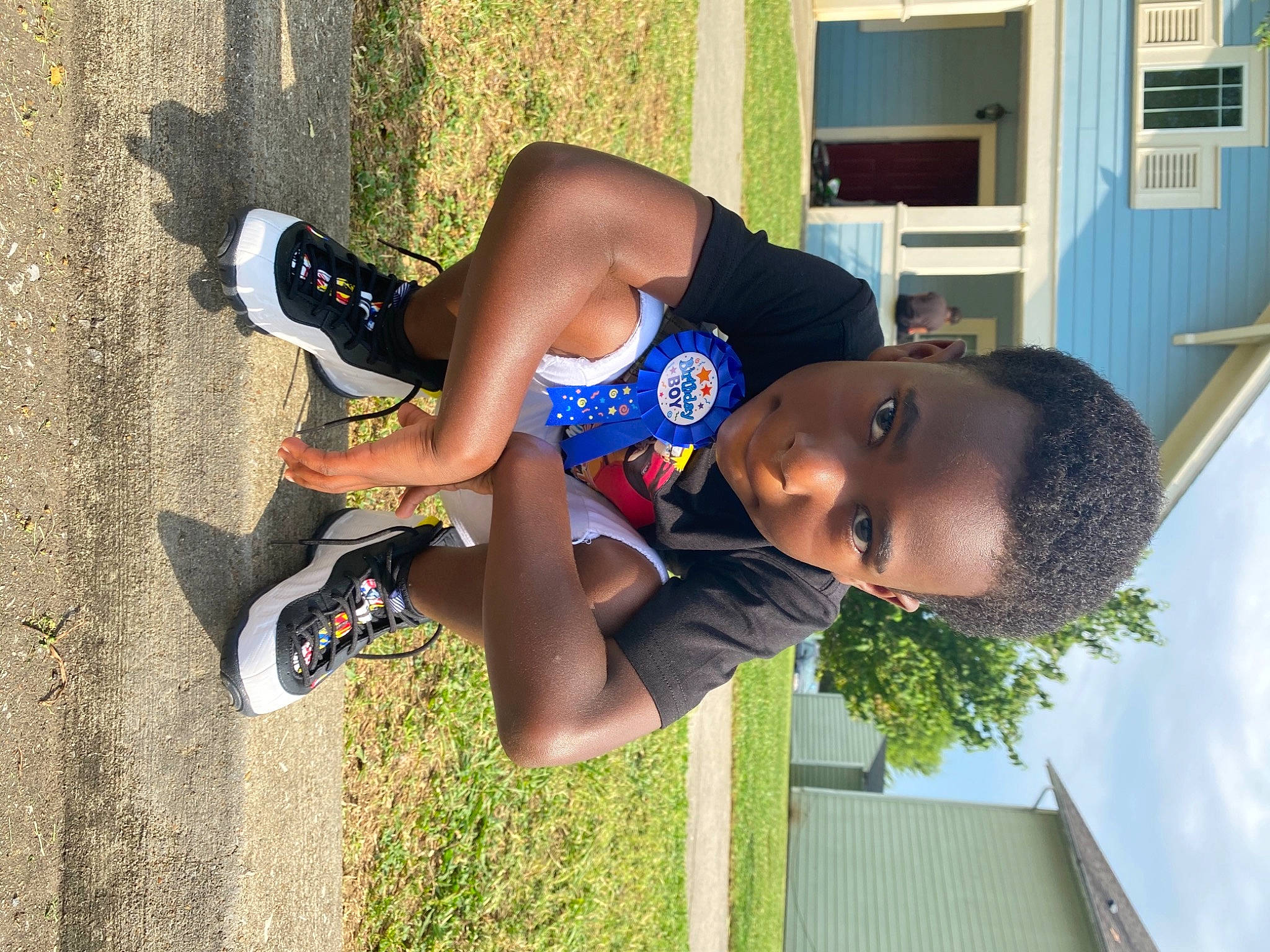 Trasean is registered to the contest to win money with this photo: child, elbow, electric_blue, fun, grass, happy, hat, human_leg, knee, leisure, person, plant, recreation, shorts, thigh, toddler, tree, vacation, walking_shoe, yellow