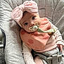 Harriet joined the competition — help win amazing prizes! baby, pacifier, headband, pink, bib, baby_seat, clothing, cushion, cute, infant, child, face, blue_eyes, sitting, hand, soft_fabric, indoors, comfort, portrait, babywear