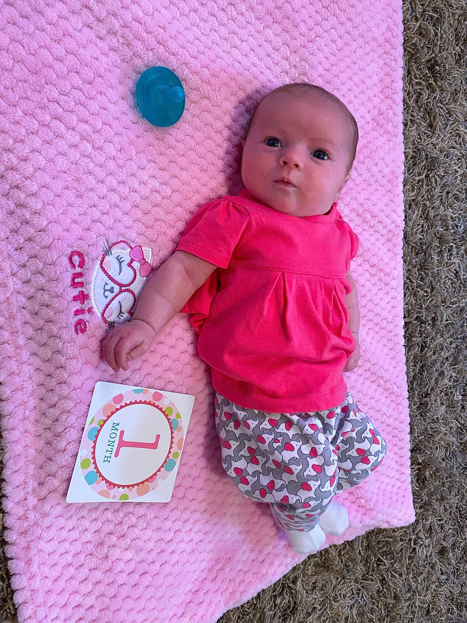 Raelynn Burchett is registered to the contest to win money with this photo: baby, baby_toddler_clothing, baby_toys, button, child, circle, doll, facial_expression, linens, magenta, outerwear, pattern, person, pink, purple, skin, sleeve, t_shirt, toddler, toy