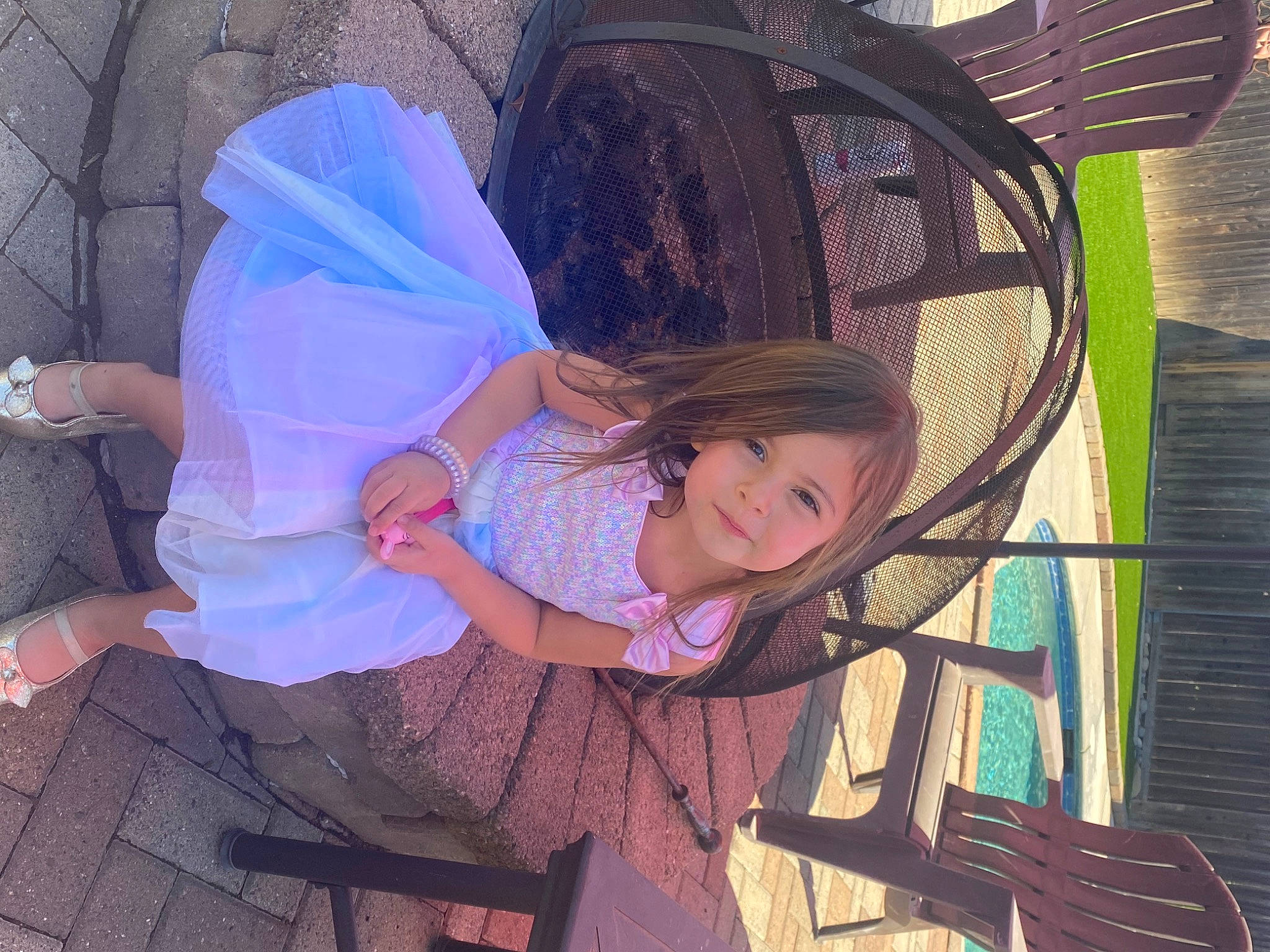 Alysia joined the competition — help win amazing prizes! baby_products, child, electric_blue, event, fashion_accessory, fun, happy, leisure, magenta, mesh, person, pink, purple, recreation, sandal, sitting, smile, tints_and_shades, toddler, tree
