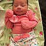 baby, infant, pacifier, pink_clothing, colorful_pants, blanket, ladybug_pattern, butterfly_pattern, cute, lying_down, soft_lighting, indoor, young_child, newborn, fabric, comfort, resting, portrait, child, cozy