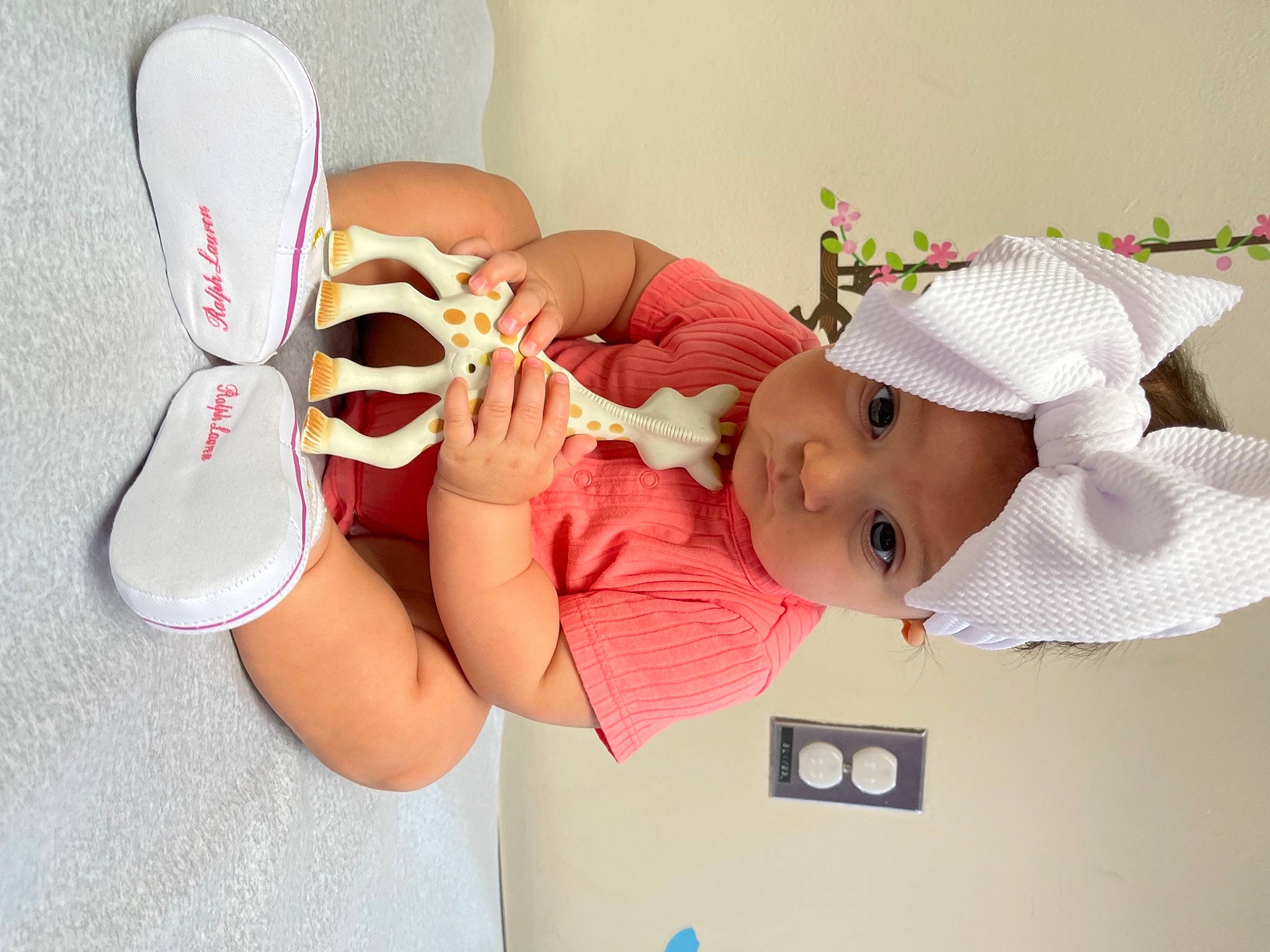 Carter is registered to the contest to win money with this photo: baby, baby_toddler_clothing, cap, child, comfort, design, eyelash, finger, gesture, happy, hat, headgear, headwear, human_body, human_leg, nail, person, pink, skin, sun_hat