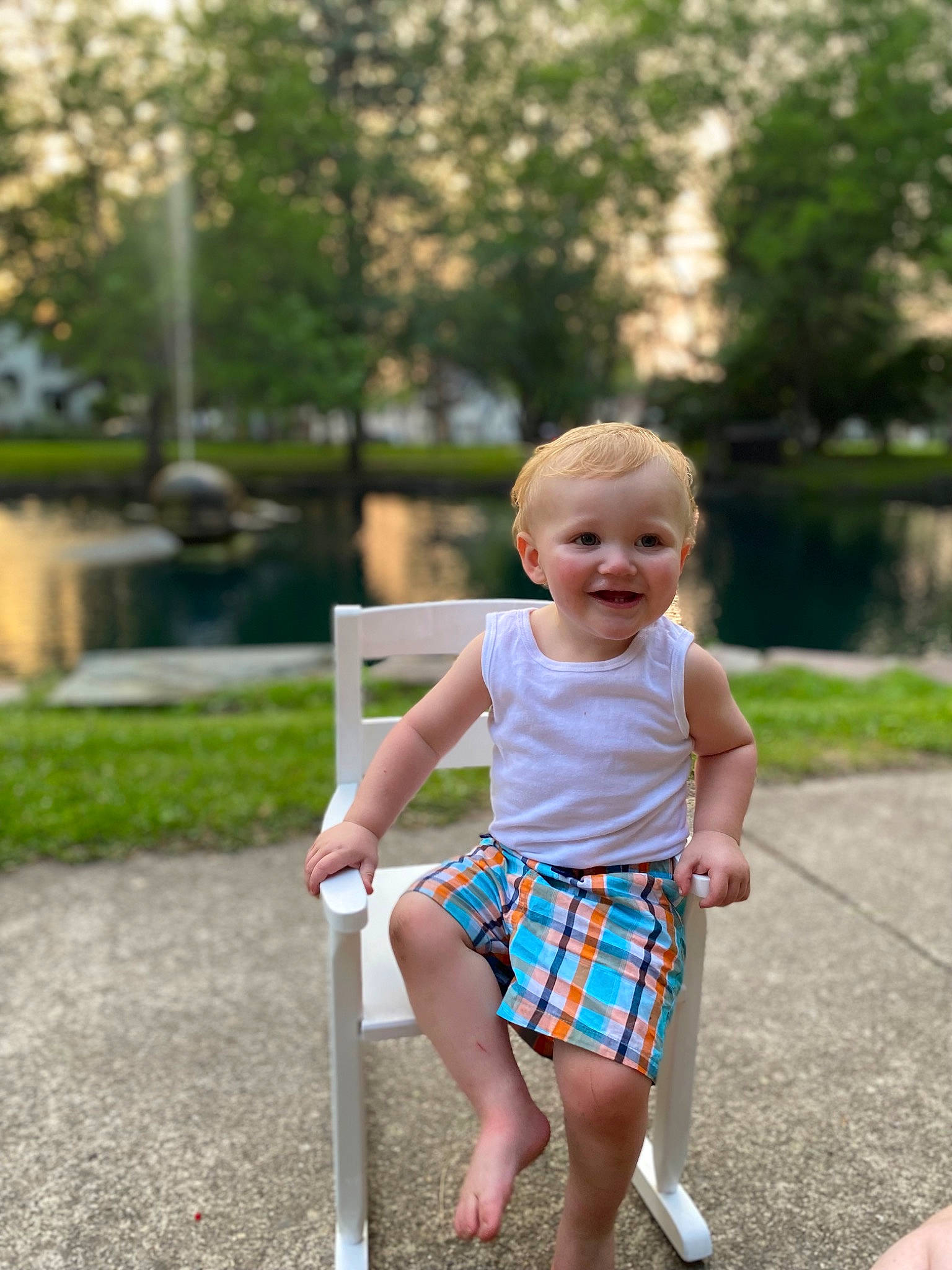 Royce is registered to the contest to win money with this photo: baby, baby_toddler_clothing, barefoot, child, fun, grass, happy, joy, leisure, pattern, people_in_nature, person, plaid, plant, recreation, shorts, sitting, smile, summer, tartan