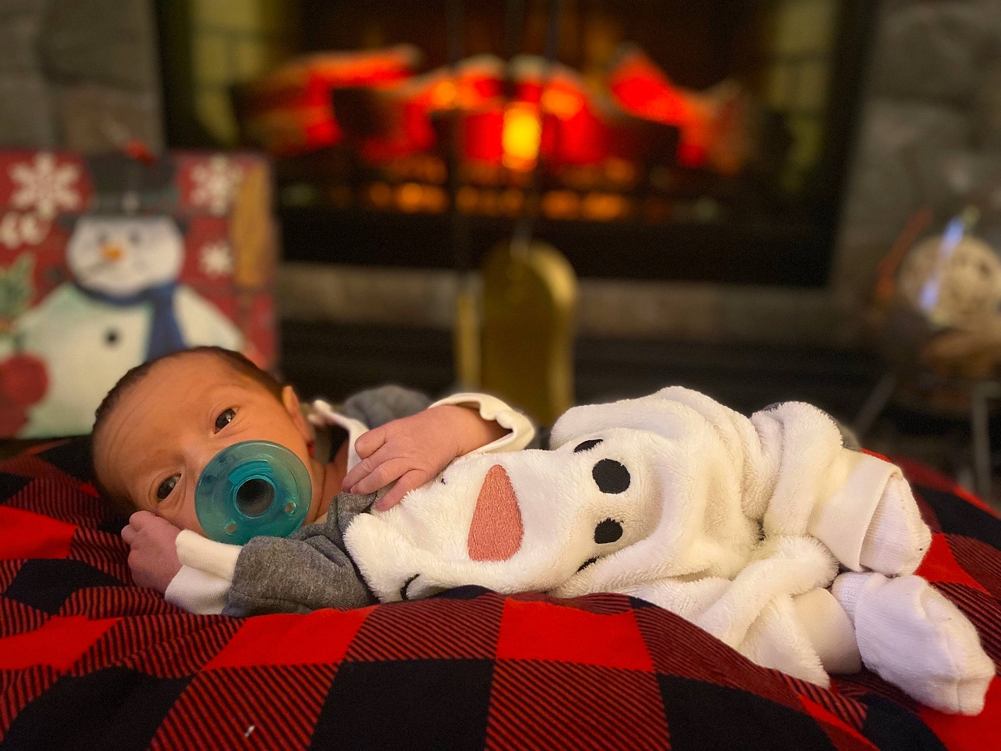 Legend is registered to the contest to win money with this photo: baby, baby_toddler_clothing, carmine, cheek, child, comfort, flooring, fun, fur, head, linens, person, plush, room, stuffed_toy, tartan, textile, toddler, toy, vertebrate