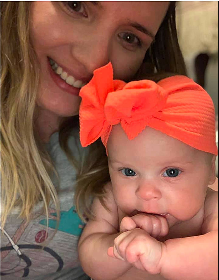 Rosie joined the competition — help win amazing prizes! baby_toddler_clothing, cheek, chin, ear, eyebrow, eyelash, face, forehead, gesture, hand, happy, headwear, iris, lip, mouth, neck, nose, orange, organ, person