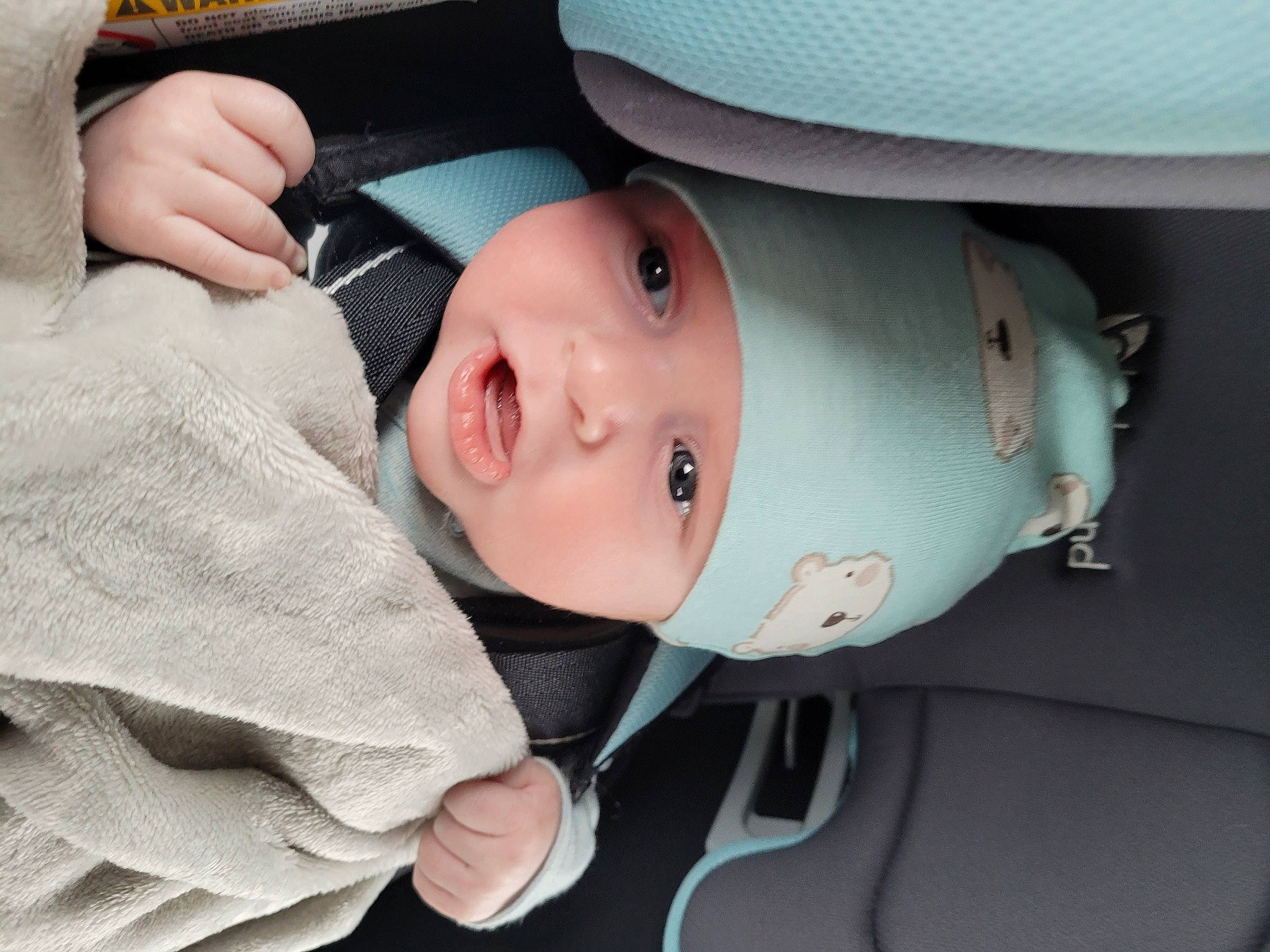 Karson is registered to the contest to win money with this photo: auto_part, baby, baby_carriage, baby_products, baby_toddler_clothing, car_seat, carmine, cheek, child, chin, comfort, fashion_accessory, hat, headwear, helmet, person, personal_protective_equipment, skin, sleeve, sports_gear