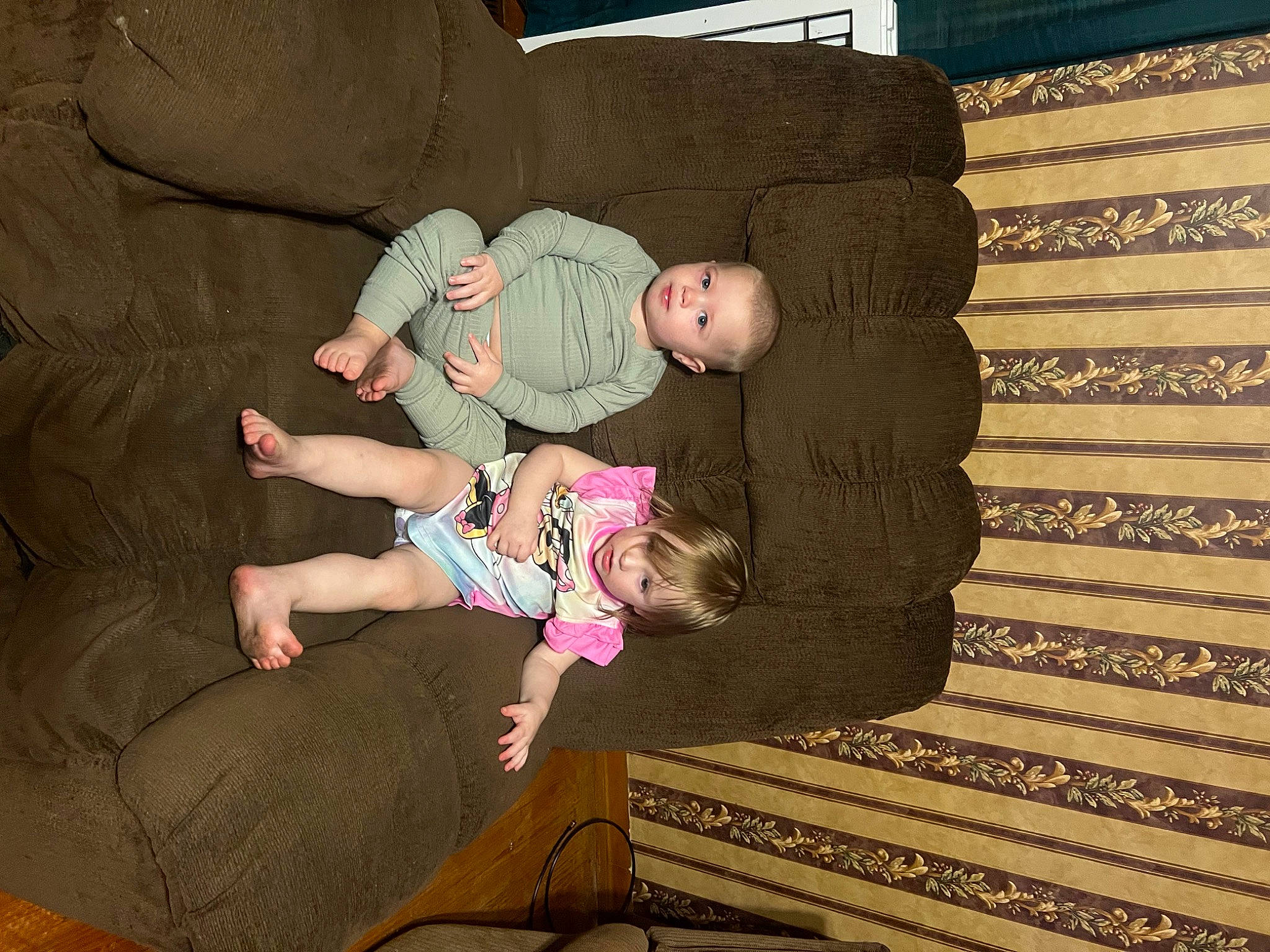 Heavenlee is registered to the contest to win money with this photo: baby, baby_toddler_clothing, child, comfort, finger, flooring, fun, hardwood, human_body, lap, leg, linens, person, room, sitting, stairs, thigh, tints_and_shades, toddler, tree