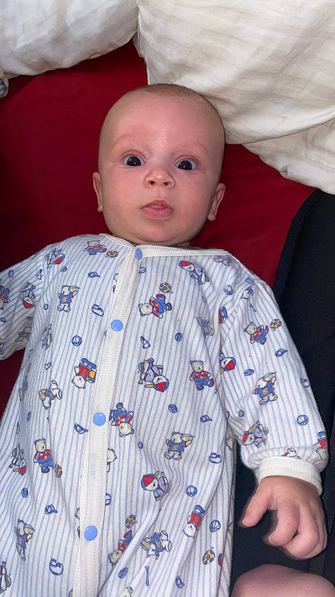 Malakai is registered to the contest to win money with this photo: baby, baby_toddler_clothing, cheek, chin, collar, comfort, dress_shirt, eye, face, head, headgear, lip, nose, organ, outerwear, person, skin, sleeve, textile, toddler